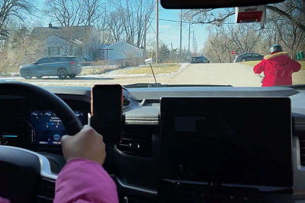 drivers view of a person on a bicycle