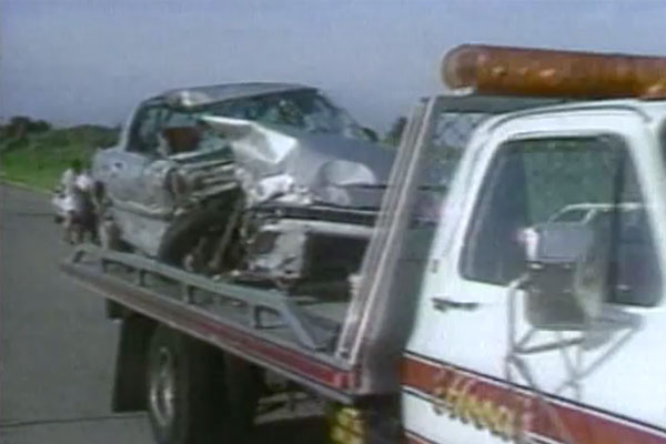 a car after a crash on top of a tow truck platform